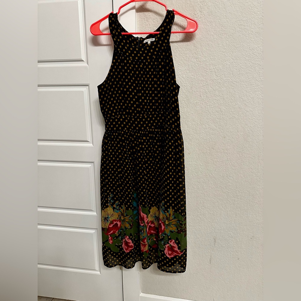 Cute black polka dotted halter style dress.